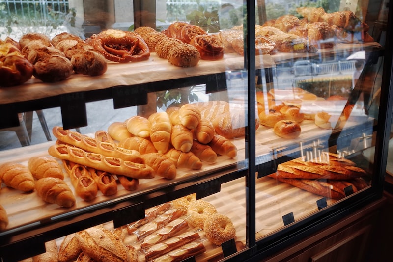 A glass display case full of fresh danishes and pastries