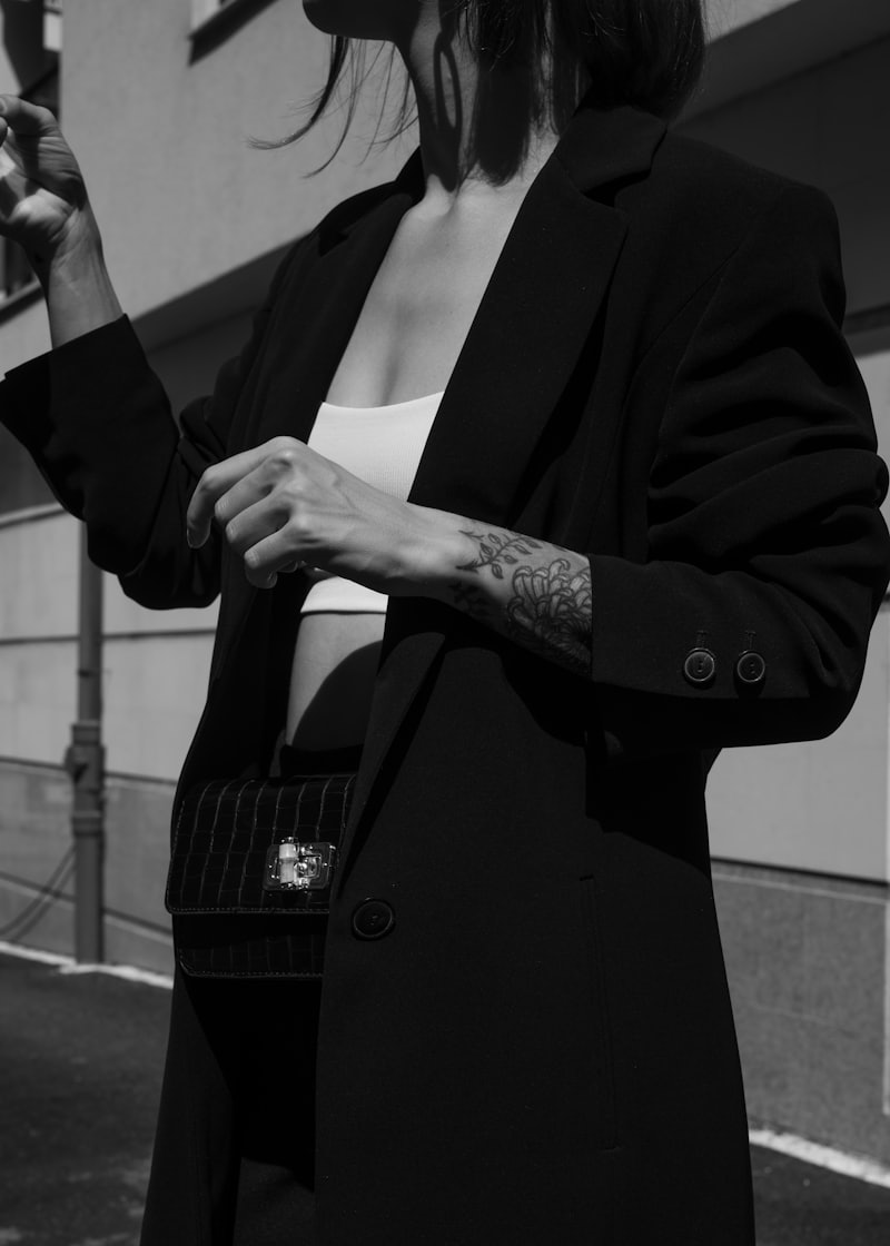 Model in a black tailored blazer, high contrast