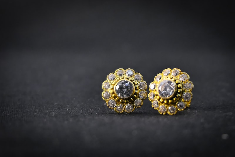 A pair of gold and diamond stud earrings