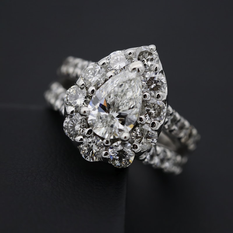 Brilliant-cut diamond solitaire ring on a dark surface