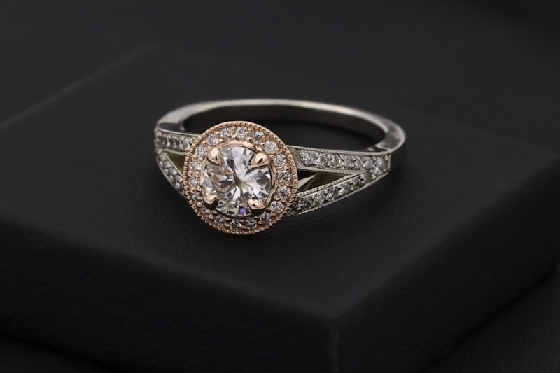 Halo diamond engagement ring on black