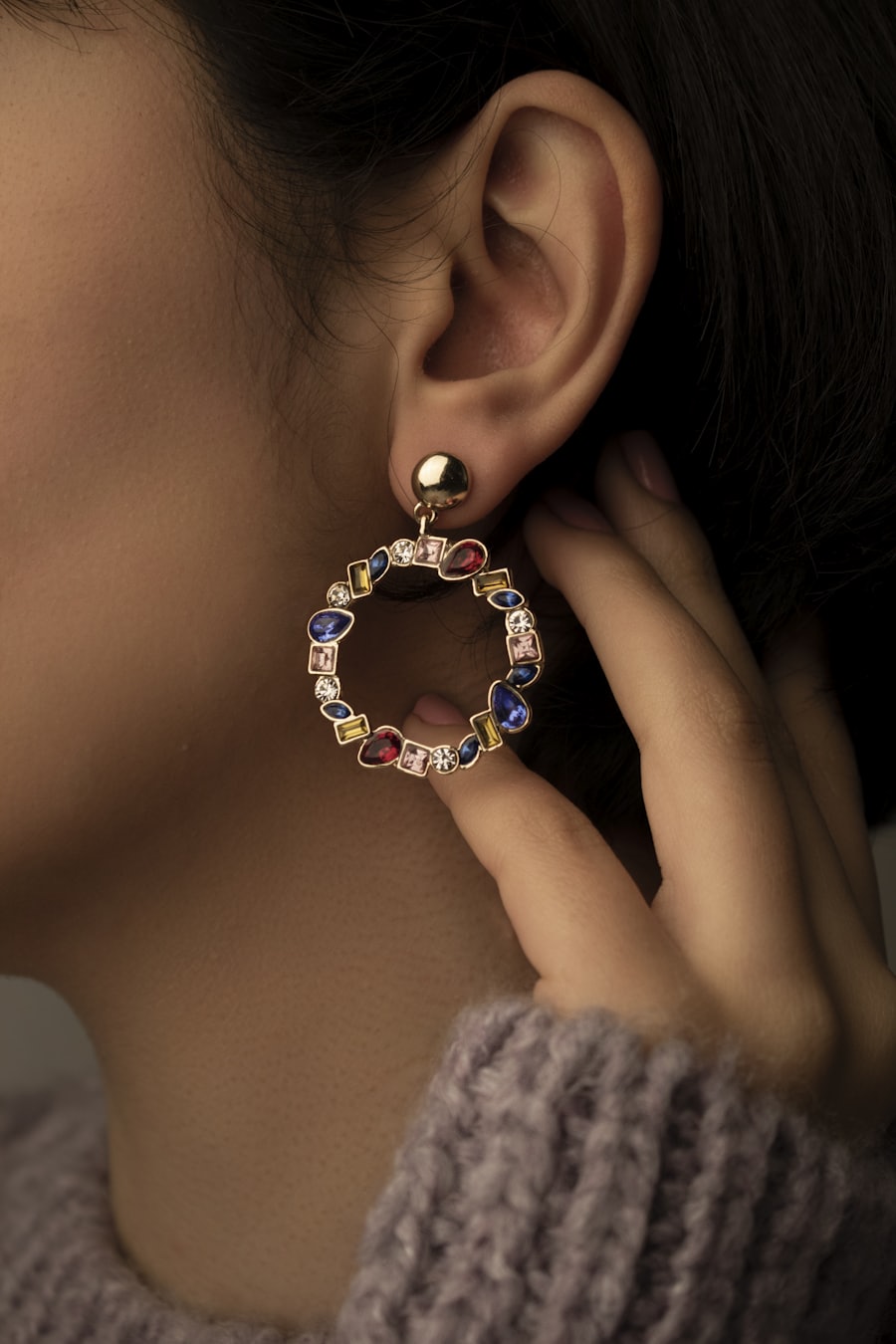 A delicate drop earring worn on the ear