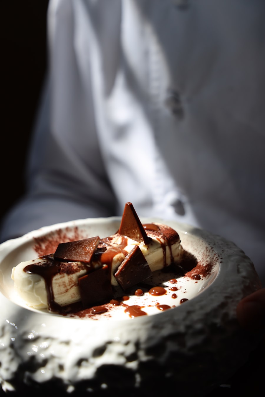 Chef presenting a chocolate dessert plate