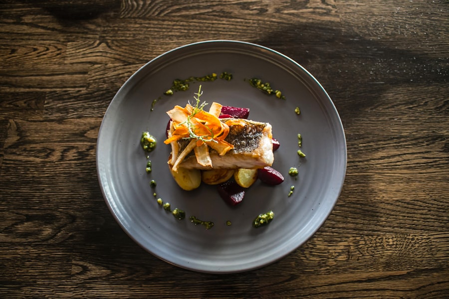 Wood-grilled turbot on a grey plate over dark wood